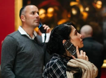 Visitors using audio guides, <br>
Courtesy National Gallery of                               Ireland